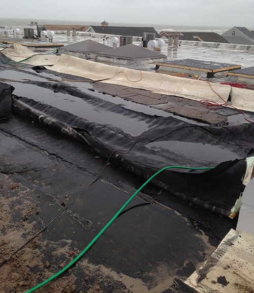 Storm damage to roof along the shoreline.