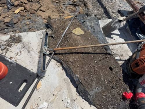 Built up roof tear off in progress with rusted deck shown below. 