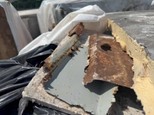 Pieces of fragile dangerous rusted deck.